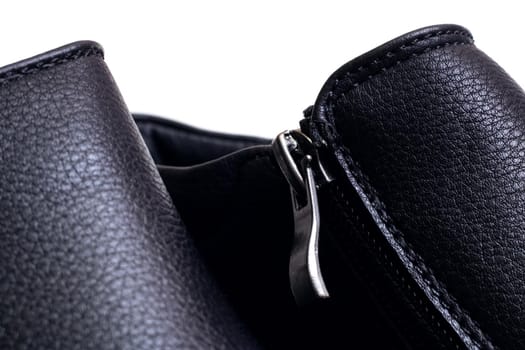 Zipper on men's shoes on a white background close up