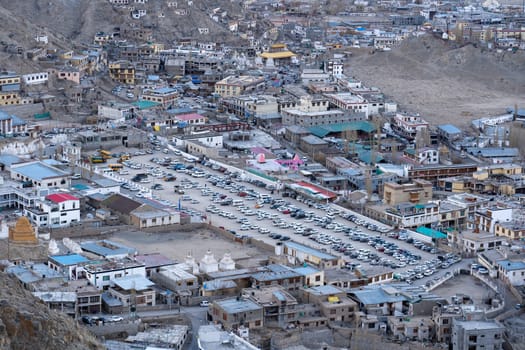 LEh, India - April 02, 2023: The polo ground, which is used as parking lot, in the historic city centre
