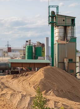 Cement plant and mountains of sand. High quality photo