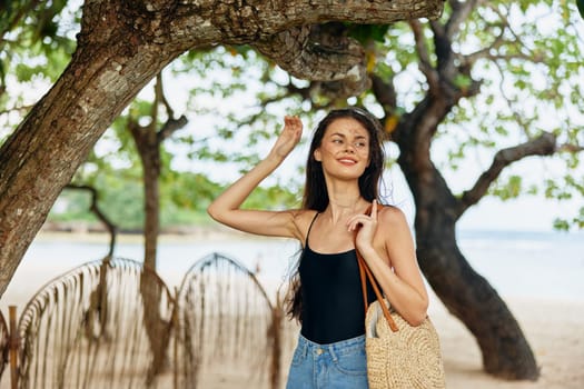 woman freedom walk vacation hair beach water young smiling sunlight person beauty sea dress running smile long carefree summer ocean nature sand