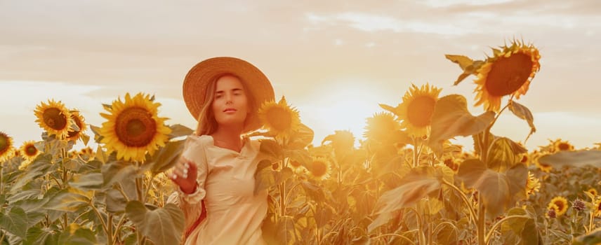 Woman in the sunflowers field. Summer time. Young beautiful woman standing in sunflower field.