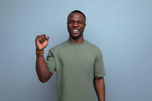 young handsome well-groomed handsome american guy dressed in basic t-shirt isolated with copy space background.