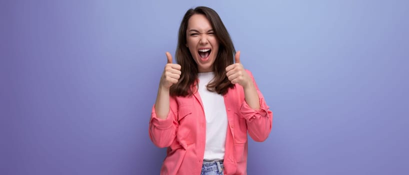 surprised brunette young woman in casual outfit smiling over isolated background.