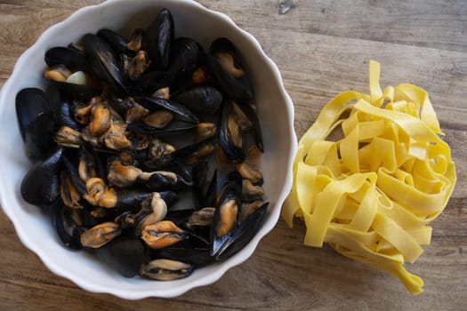 raw egg tagliatelle with tomato and mussels