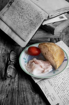 fast menu with bread and cooked ham while studying. Color and black and white