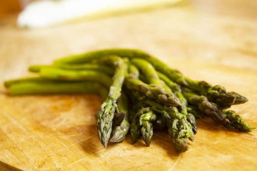 steamed asparagus on a wooden background