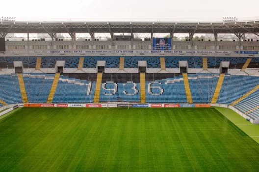 Ukraine, Odessa. September 24, 2017. Chernomorets Stadium. Empty stands of the stadium. Green lawn. There is no football. Odessa was left without football