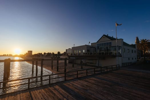 Kerford Rd Pier and Albert Park Yachting & Angling Club in Albert Park at sunset on a winter's evening in Melbourne, Victoria, Australia
