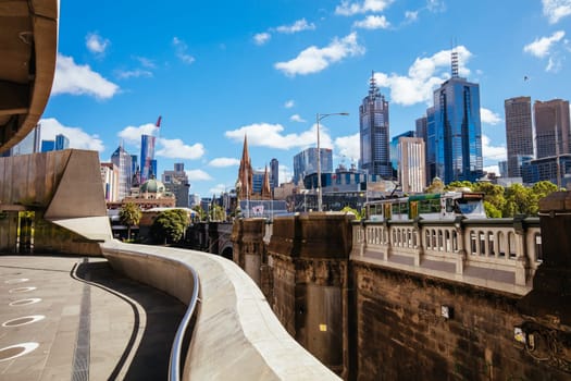 MELBOURNE, AUSTRALIA - OCTOBER 31, 2021: Views towards Melbourne CBD and Princes Bridge along the Yarra River at Birrarung Marr in Melbourne, Victoria, Australia