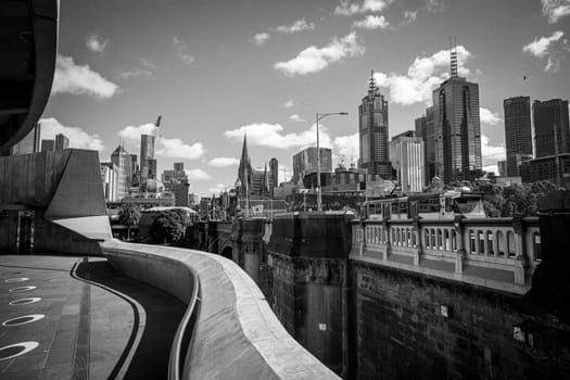 MELBOURNE, AUSTRALIA - OCTOBER 31, 2021: Views towards Melbourne CBD and Princes Bridge along the Yarra River at Birrarung Marr in Melbourne, Victoria, Australia