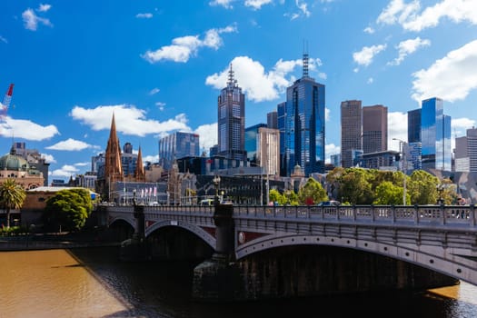 MELBOURNE, AUSTRALIA - OCTOBER 31, 2021: Views towards Melbourne CBD and Princes Bridge along the Yarra River at Birrarung Marr in Melbourne, Victoria, Australia