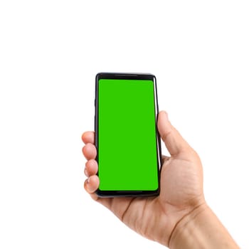 Male hand holds black smartphone. Isolated screen with chroma key and all isolated on white background