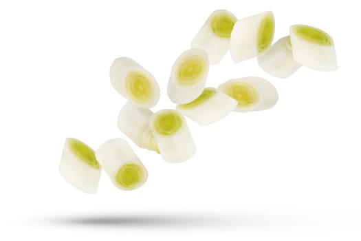 Leek slices. White and green onion slices isolated on white background. A group of leek slices of different sizes and shapes scatter in different directions. High quality photo