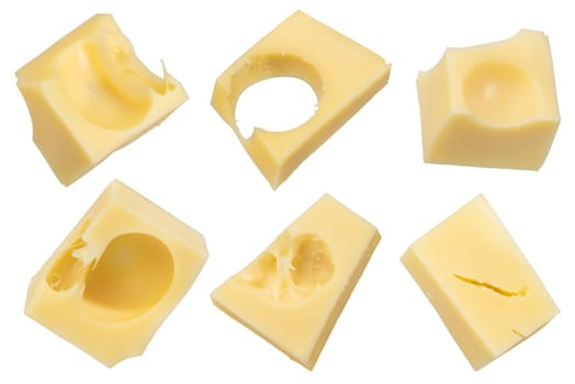 Pieces of emmental cheese on a white isolated background. Pieces fly off in all directions. To be inserted into a design or project. High quality photo