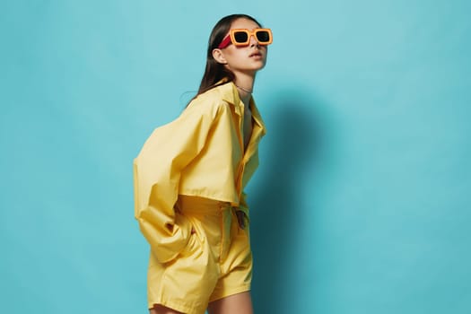 blue: woman hairstyle background beautiful funny trendy sunglasses fashion yellow attractive young stylish expression brunette lifestyle girl lady beauty romance outfit pretty