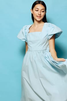 woman happy studio relax beautiful trendy blue glamour joy lady model dress young style smile clothes pretty fashion summer pastel lifestyle