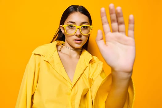woman fashion cheerful long portrait yellow dance glamour attractive person hair girl trendy gesture lifestyle beautiful glasses beauty monochrome funny emotion young