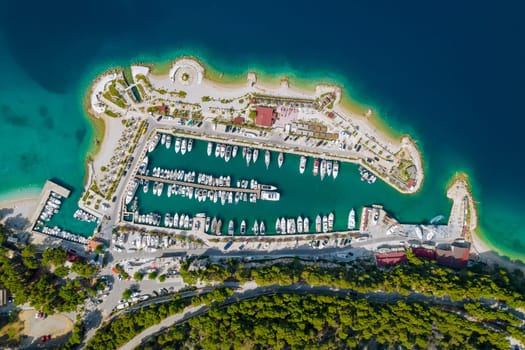 View from above of sea and the tourist town opens picturesque panorama of coast of Makarska. Vacation at sea.
