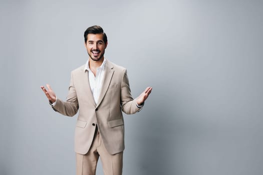 man beige crossed model guy handsome portrait smiling male businessman attractive copyspace studio suit white happy business job folded background beard