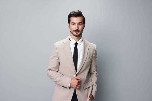 man crossed grey office suit handsome copyspace corporate formal beige smiling stylish job folded business entrepreneur happy beard businessman person portrait