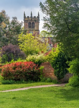 Church tower of parish church of St Mary in Ellesmere Shropshire from gardens