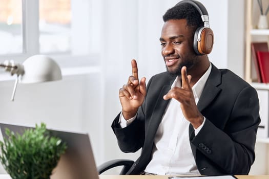 man student learning teenage dance education video office call distance distant online zoom laptop headphone african businessman work indoor american person computer e-learning