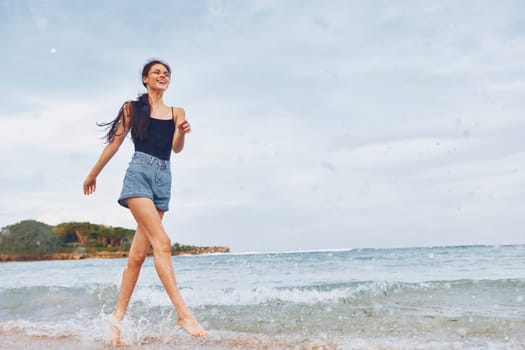 woman lifestyle sunset travel running summer girl fun bikini nature young flight shore wave sea vacation sexy relax beach smile smiling