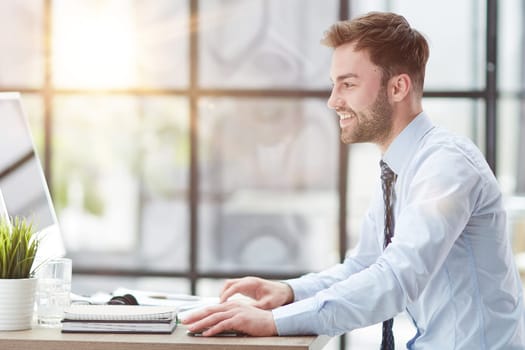 Young businessman working at office