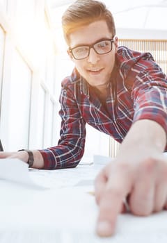 Male Architect working at the modern light office