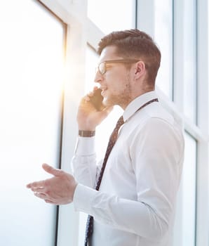 bearded man talking on phone and smiling