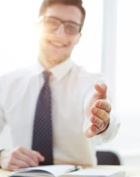 Smiling businessman pleased to meet you at office