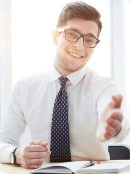 Smiling businessman pleased to meet you at office