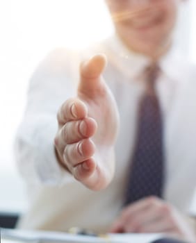 Smiling businessman pleased to meet you at office