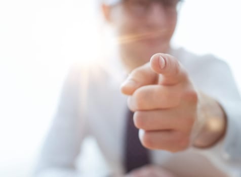 businessman pointing his finger to you at office