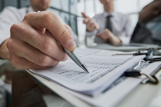 Business valuation and audit. Close-up of checking invoices.