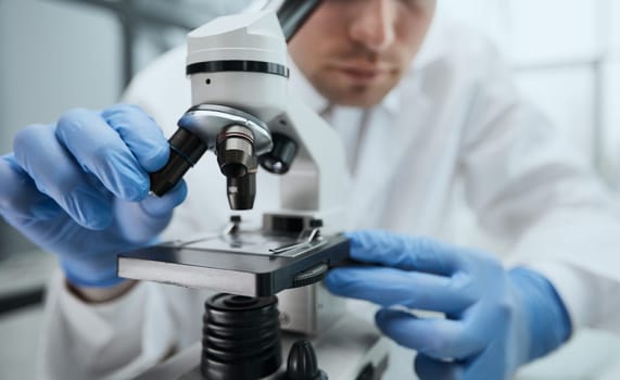 Young Biotechnology Specialist, Using Advanced Equipment.