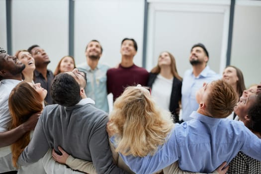 Group of happy positive smiling multiethnic men and women from different mixed race countries standing in a circle