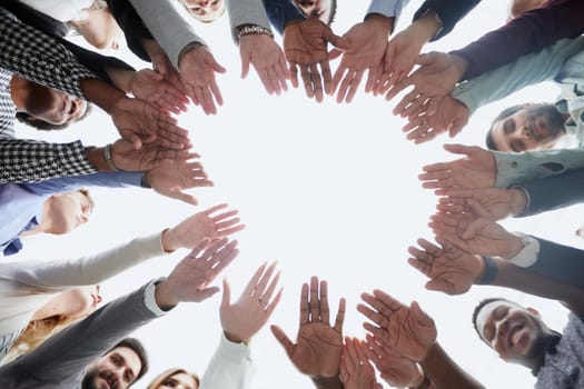 People holding hands together, view from below. Group therapy