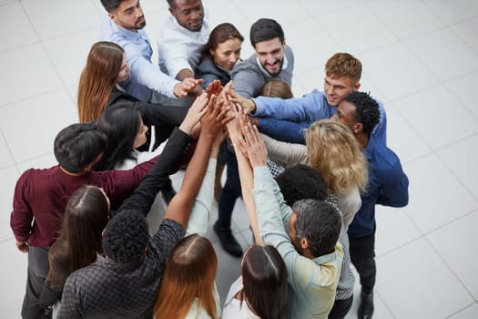 Narrow banner of multiracial people stack hands motivated for shared business success or goal achievement.