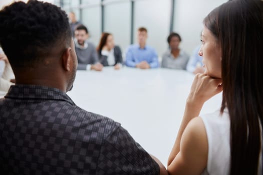 Businessmen and businesswomen talking during a meeting