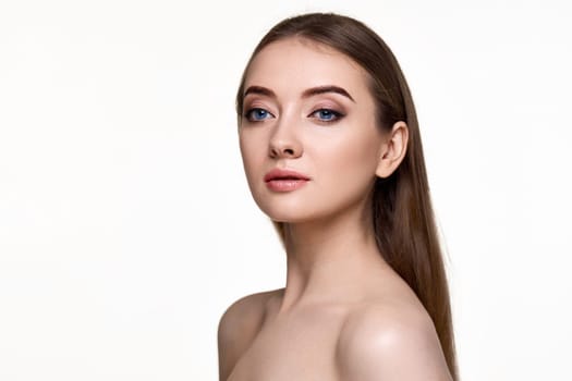 portrait of beautiful young woman with perfect skin on white background. copy space