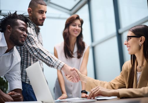 Shot of a group of businesspeople sitting together in a meeting.