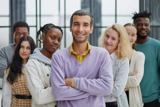 Group of business people standing at the window of a modern office