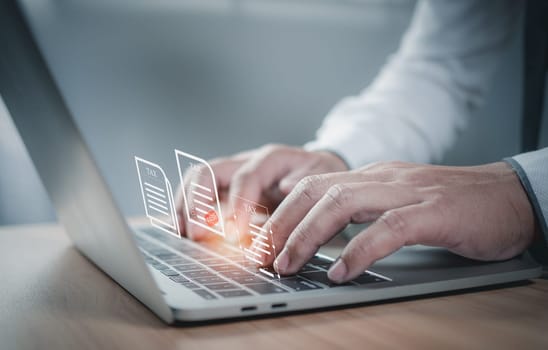 Businessman using a computer to complete Individual income tax return form online for tax payment. financial research, report. Calculation tax return.