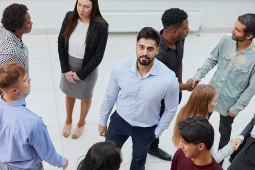 diverse business people talking in the office corridor top view