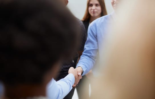 Selective focus of man's back while teaching,