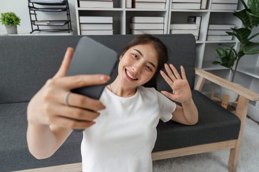 Asian woman making a video call to her friend, Online communication concept.