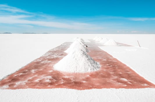 Salt hill drying under bolivian sun in Salar de Uyuni