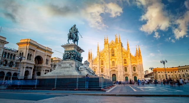 Famous piazza del Duomo in Milan at sunset