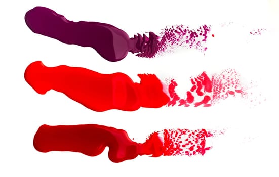 Bright spills of paint isolated on white background